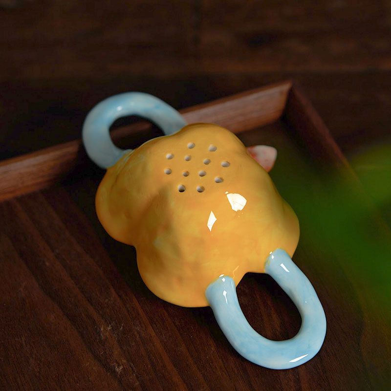 Lọc Trà Gốm Sứ Bông Vàng