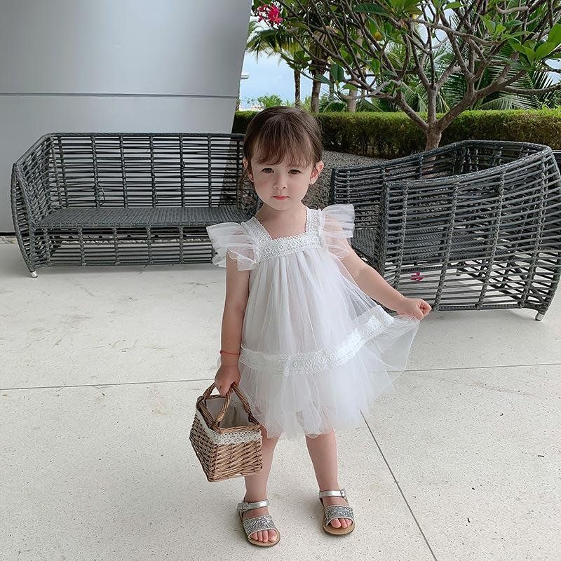Đầm hai dây chấm bi kèm nón bé gái
