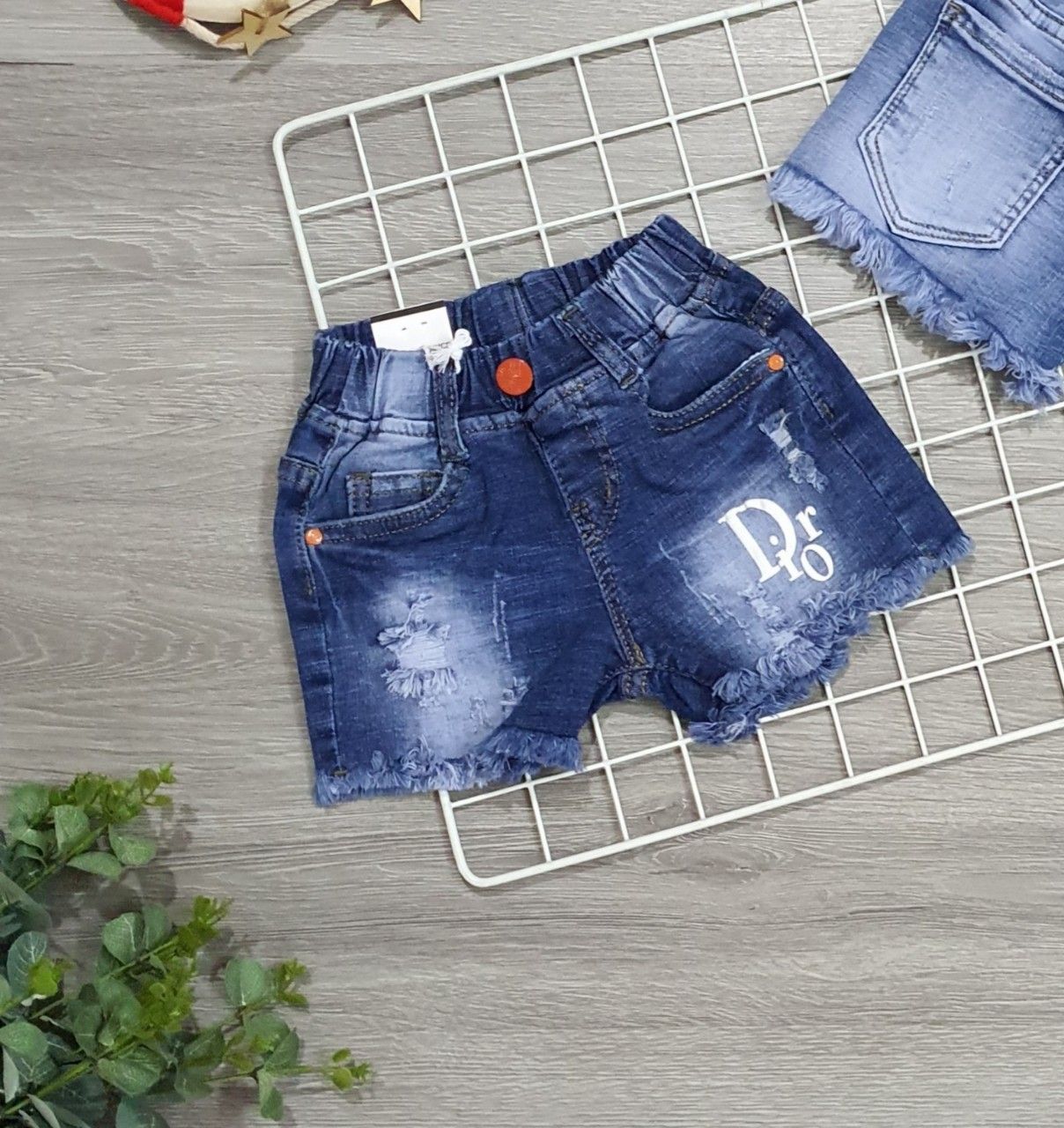 Quần jean short Dior bé gái