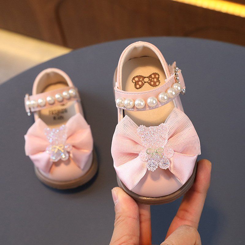 Giày búp bê tập đi da mềm nơ đính charm gấu xinh xắn cho bé gái từ 0-1 tuổi