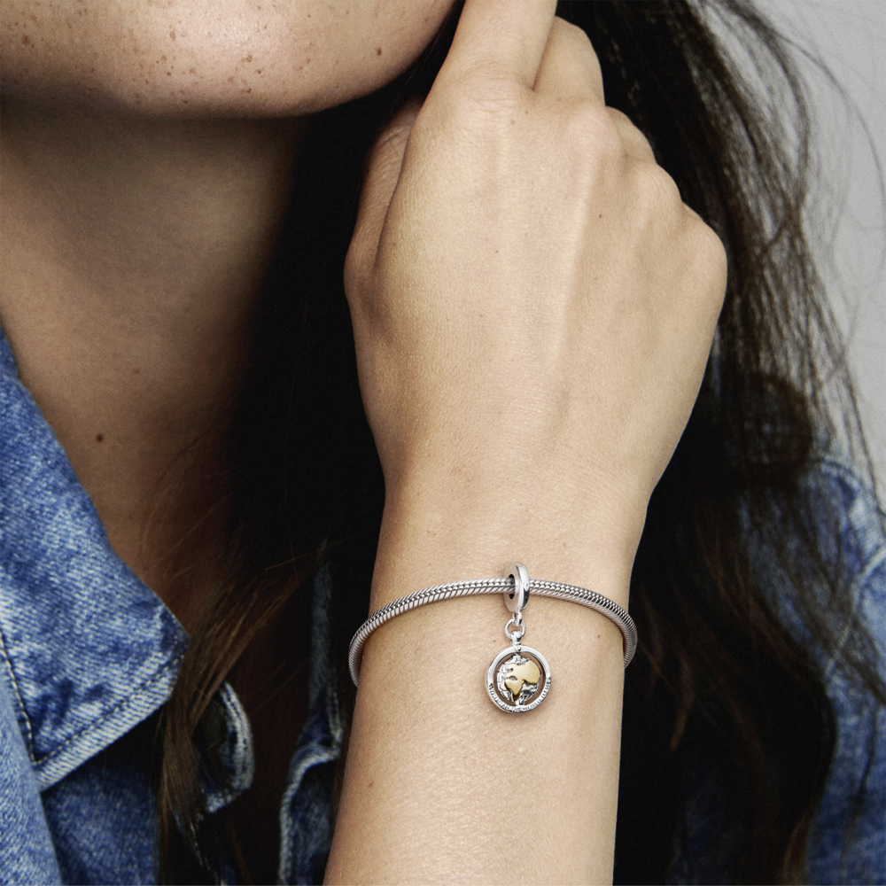Spinning world sterling silver and 14k gold dangle with CZ
