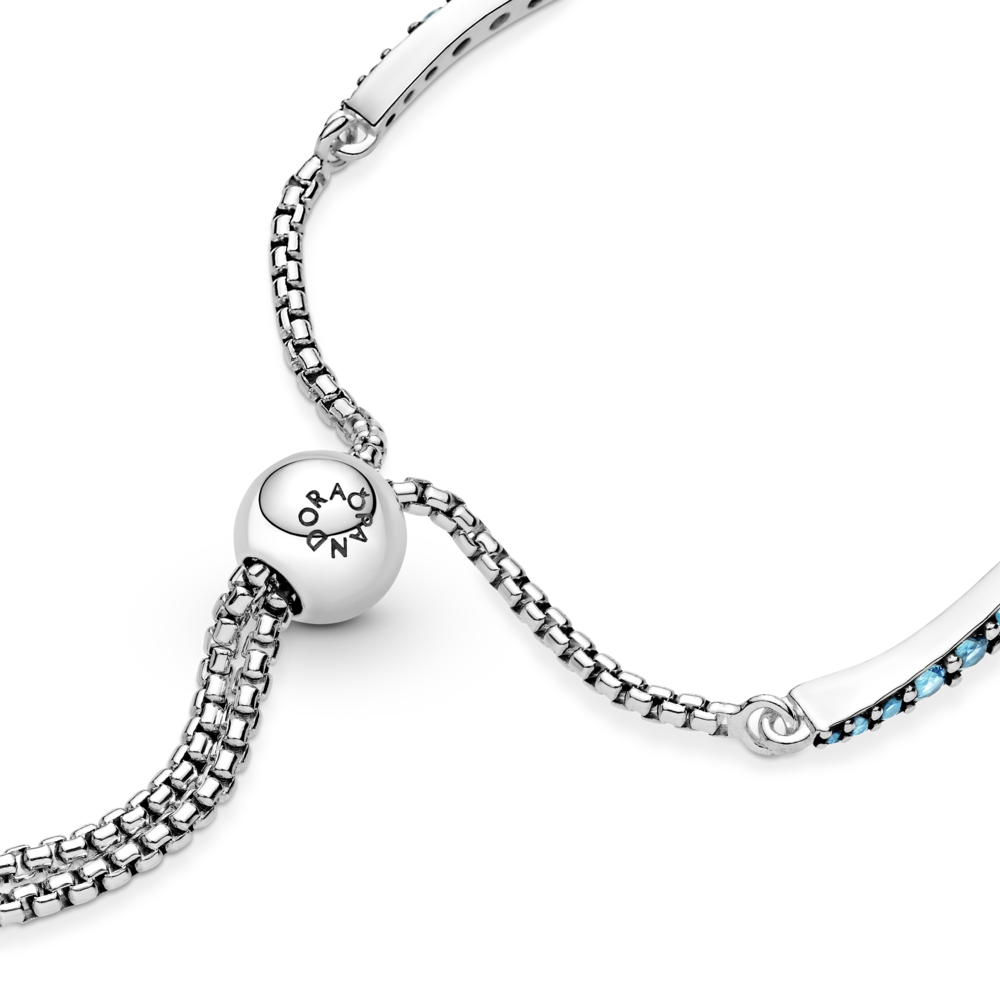 Wavy sterling silver slider bracelet with icy green crystal