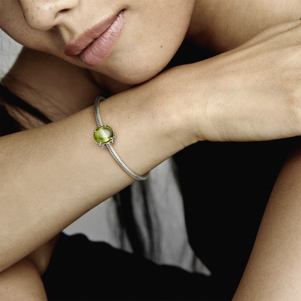 Sterling silver charm with light green and kiwi limegreen crystal