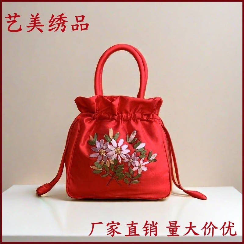 Túi cầm tay áo dài tết 69k