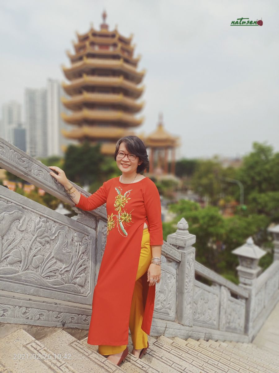 Áo dài Cam Energy thêu tay Cúc Quỳnh