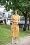  Đầm thêu tay Cúc Quỳnh vàng mustard WarpDress 