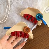 Kẹp càng cua cúc áo