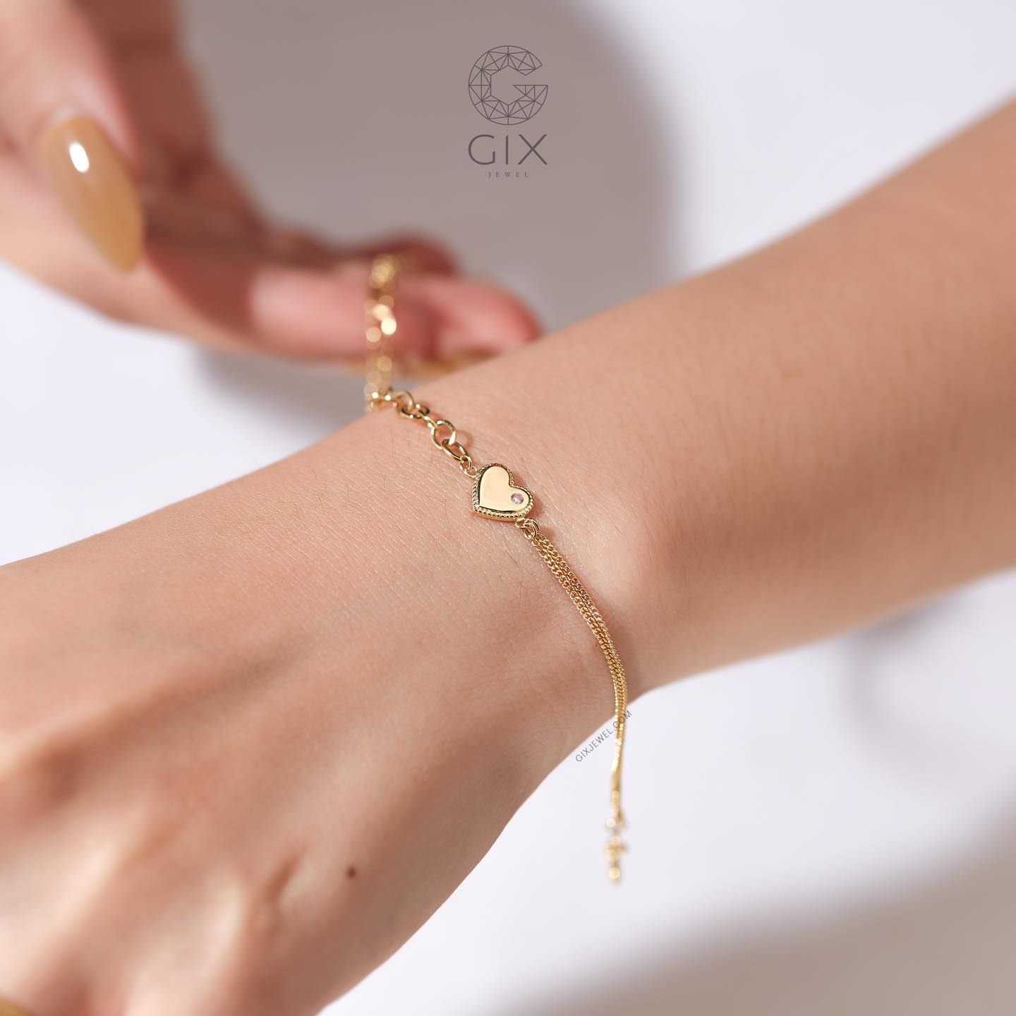 Vòng tay vàng mắc xích vuông kèm dây khoen lật hình trái tim gắn đá quý Gix Jewel
