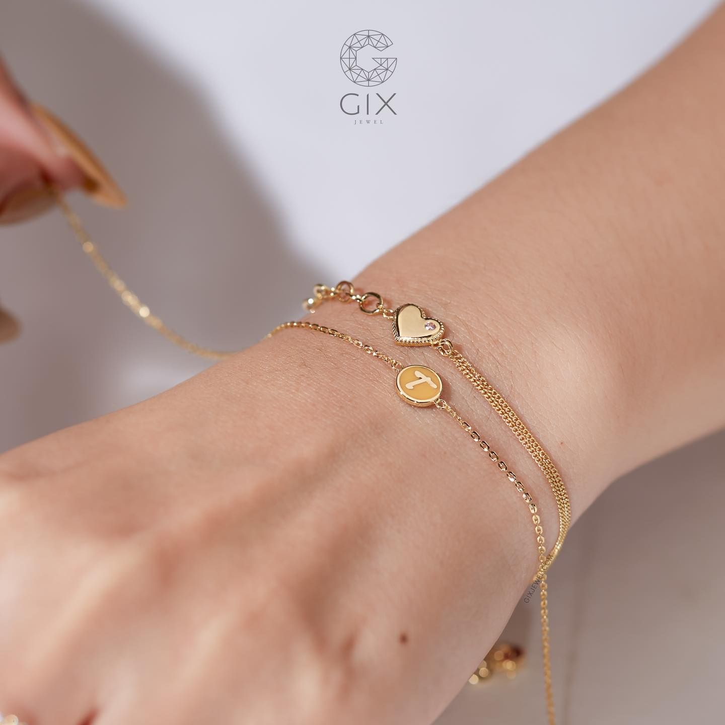 Vòng tay vàng mắc xích vuông kèm dây khoen lật hình trái tim gắn đá quý Gix Jewel