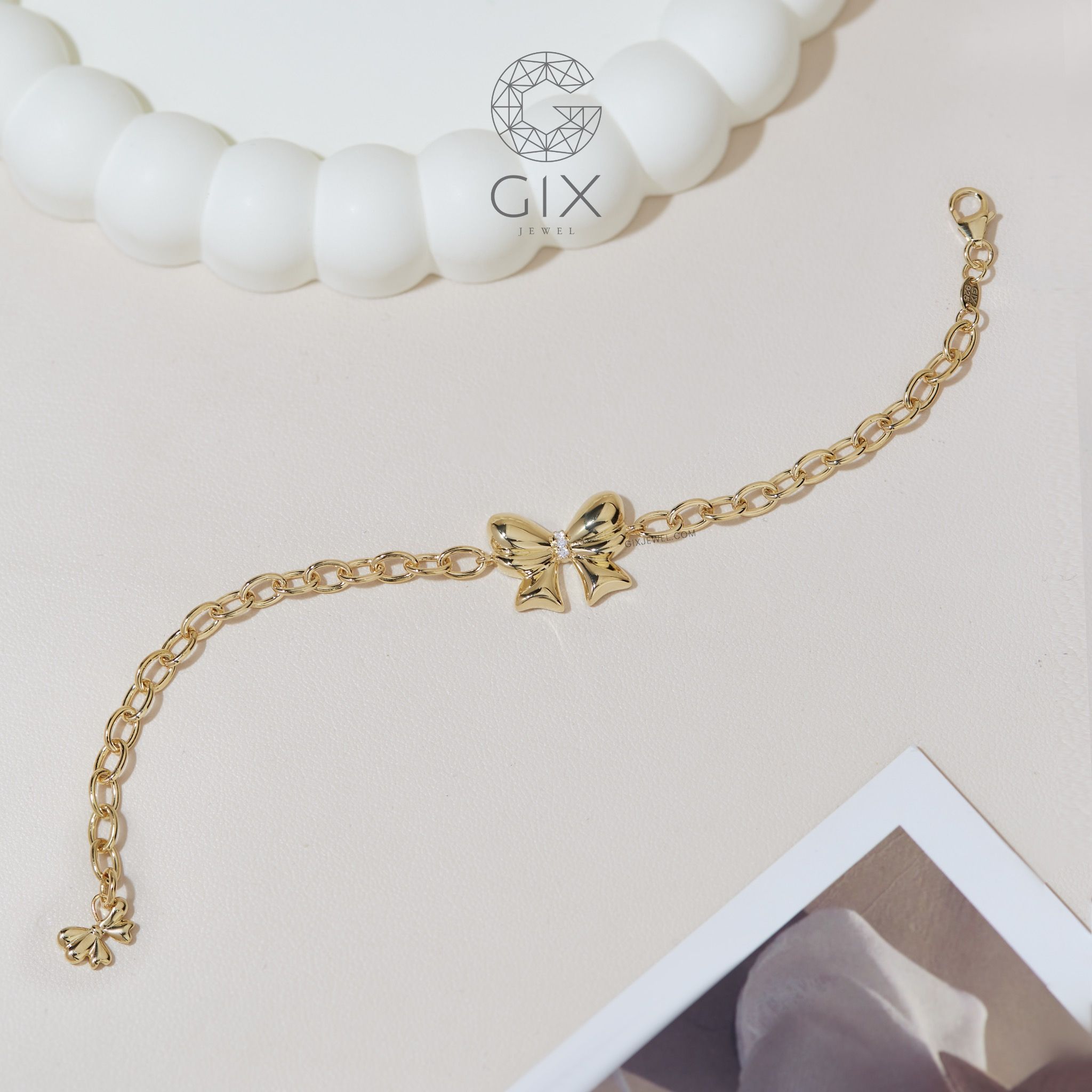 Vòng tay vàng nữ may mắn mắc xích vuông 18k bạc đẹp gắn charm hình nơ dễ thương Gix
