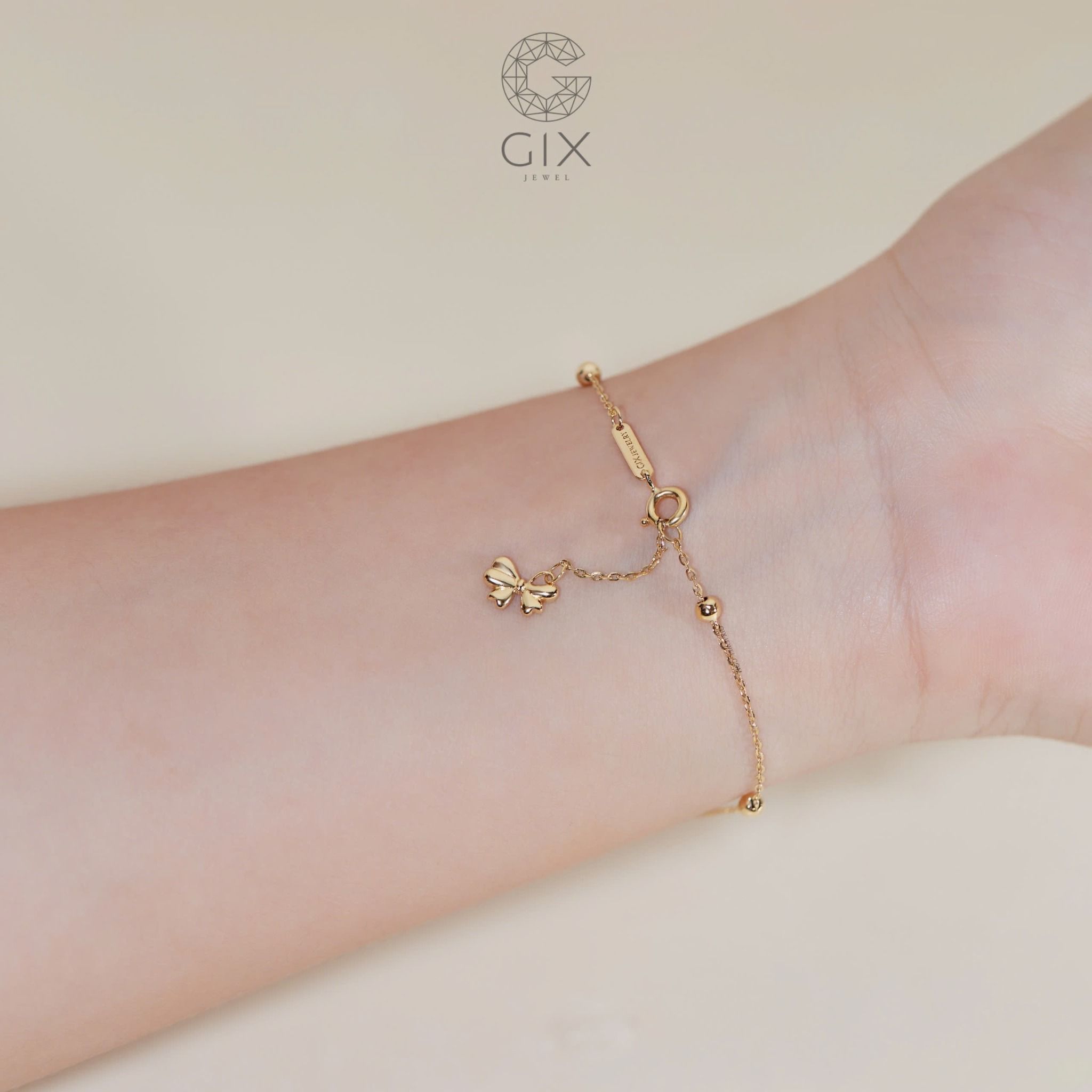 Vòng tay vàng trắng 18k bi tròn kiểu dây xích mảnh hot trend gắn charm vàng hình nơ xinh