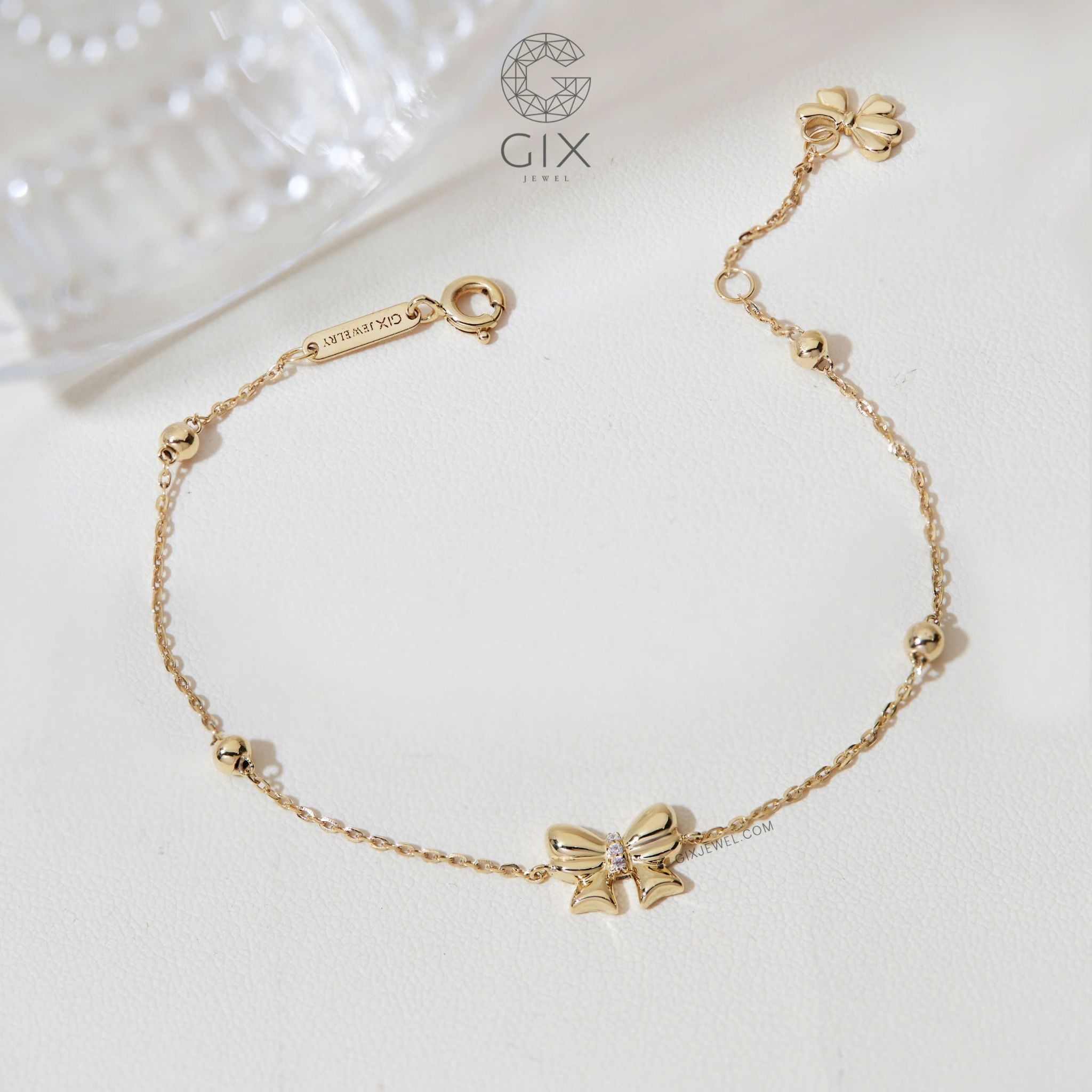 Vòng tay vàng trắng 18k bi tròn kiểu dây xích mảnh hot trend gắn charm vàng hình nơ xinh