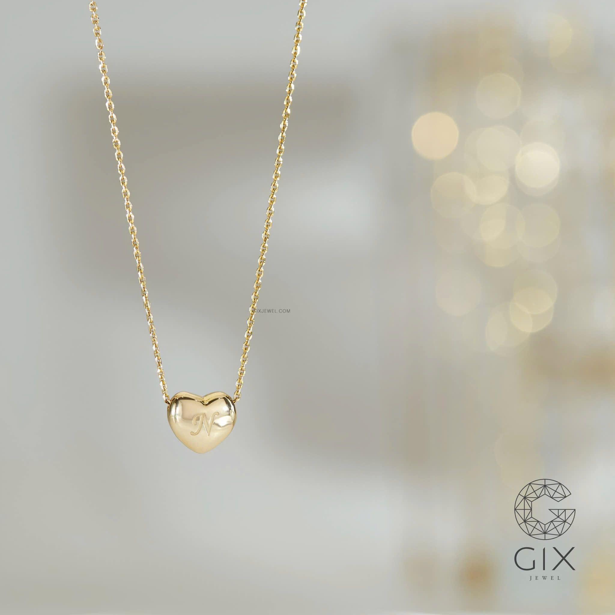 Mặt dây chuyền trái tim bạc và vàng 18k khắc chữ theo yêu cầu