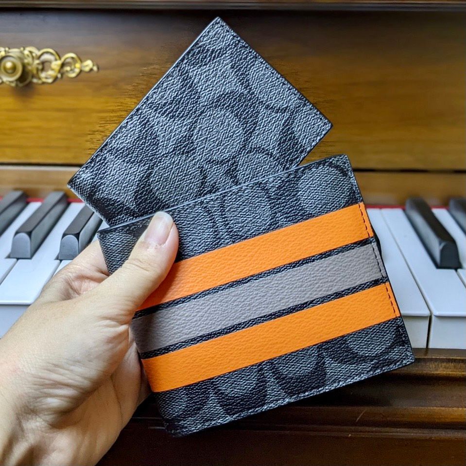 1755 - HÀNG CHÍNH HÃNG - Ví Coach Ngắn Logo Sọc Nổi Cam Trắng Đen 850K *2024