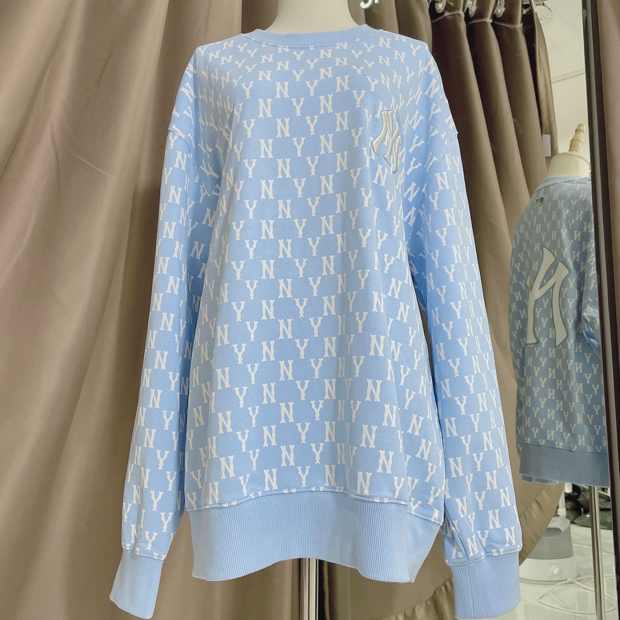 1662 - HÀNG CHÍNH HÃNG - ÁO SWEATER MLB MONOGRAM ALLOVER OVERFIT SWEATSHIRT NEW YORK *NY BABYBLUE* - CODE: 3AMTM0221-50BLL