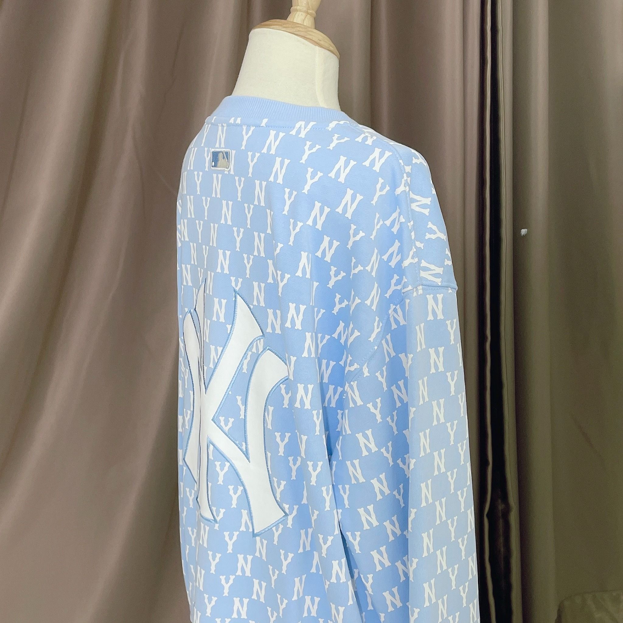 1662 - HÀNG CHÍNH HÃNG - ÁO SWEATER MLB MONOGRAM ALLOVER OVERFIT SWEATSHIRT NEW YORK *NY BABYBLUE* - CODE: 3AMTM0221-50BLL
