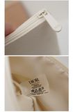 Túi Đựng Mỹ Phẩm Dior Họa Tiết Nổi Màu Kem 27x19.5cm