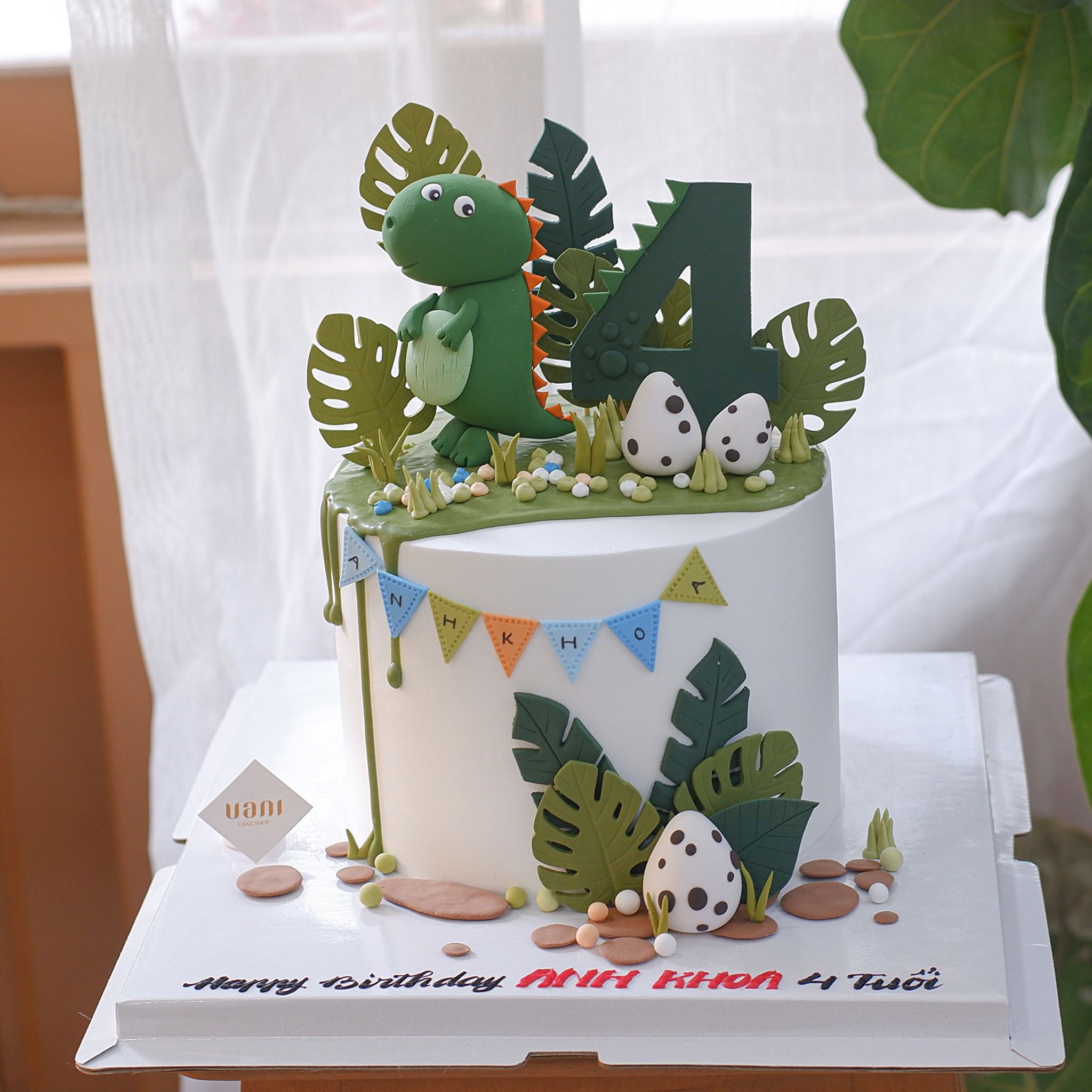 Bánh gắn tượng khủng long
