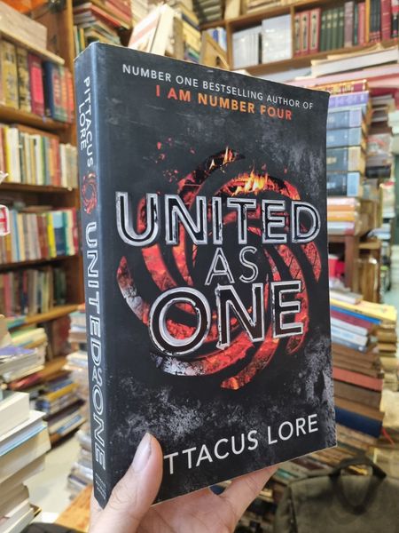 United As One - Pittacus Lore – Momo Bookstore