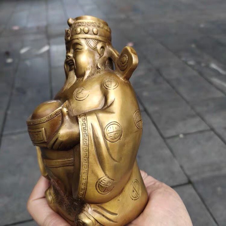 Đồ trang trí Thần tài cầm thỏi vàng
