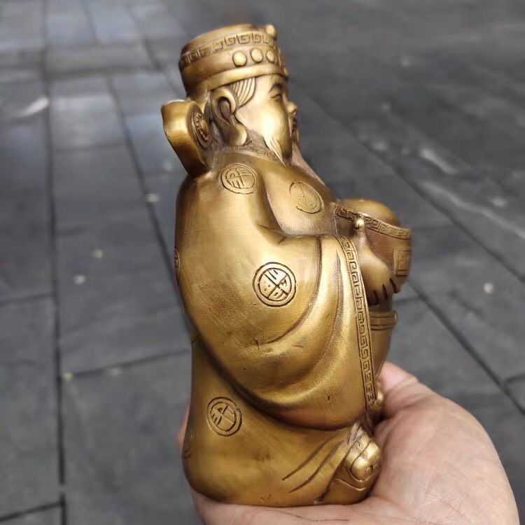 Đồ trang trí Thần tài cầm thỏi vàng