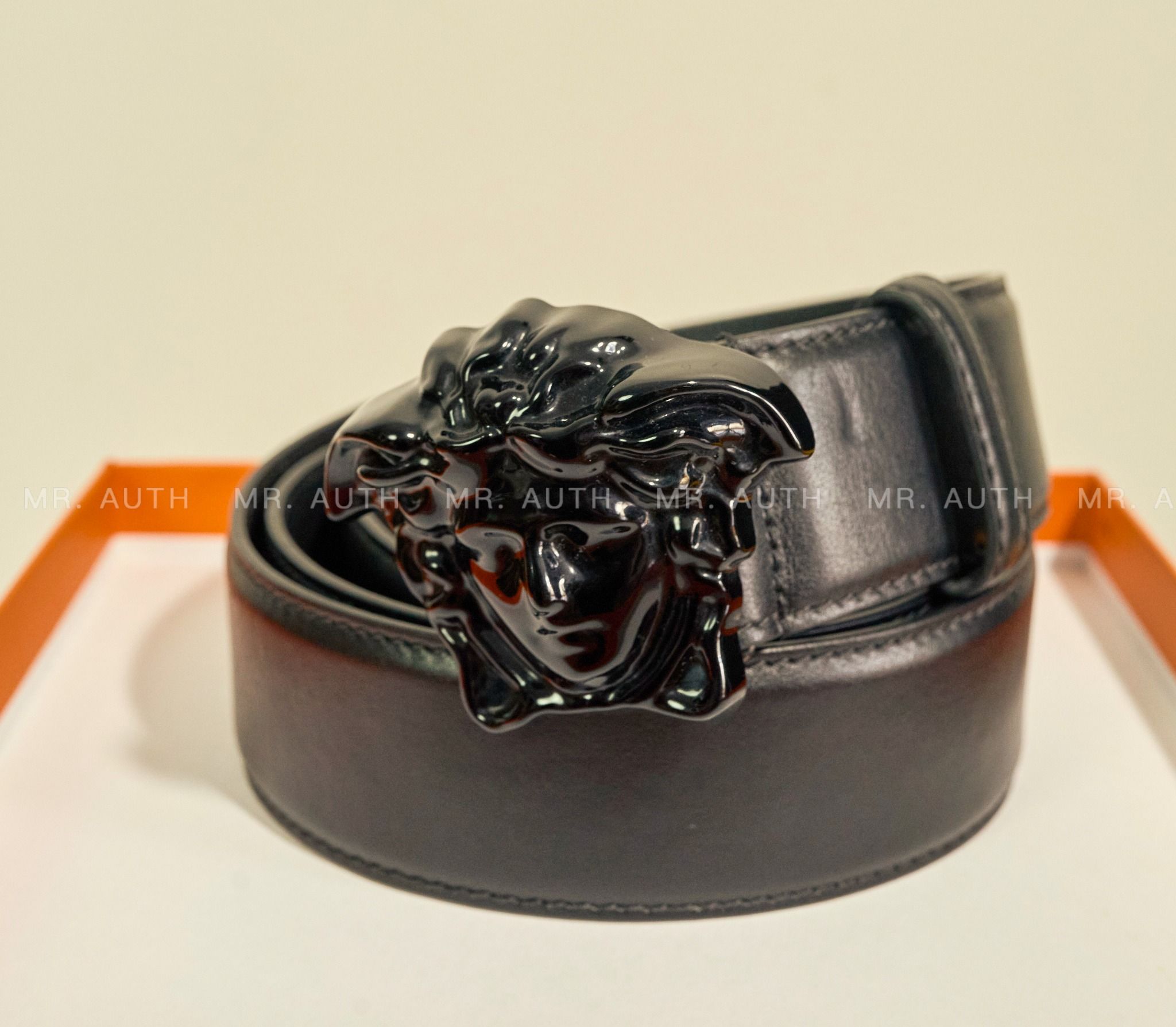 Versace Medusa Embossed Greca Leather Belt.