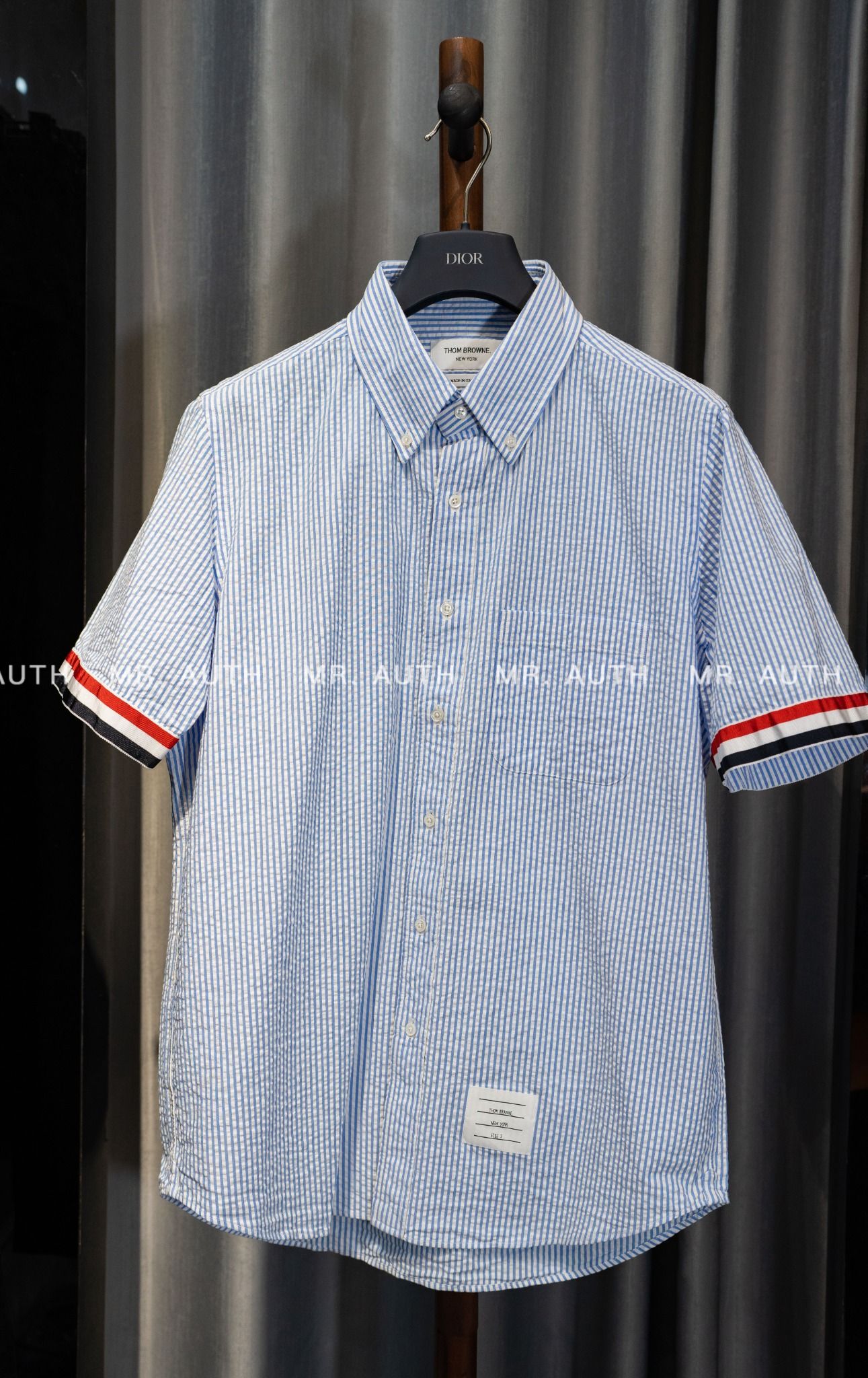Thom Browne Light Blue Cotton Seersucker Grosgrain Cuff Straight Fit Short Sleeve Shirt.