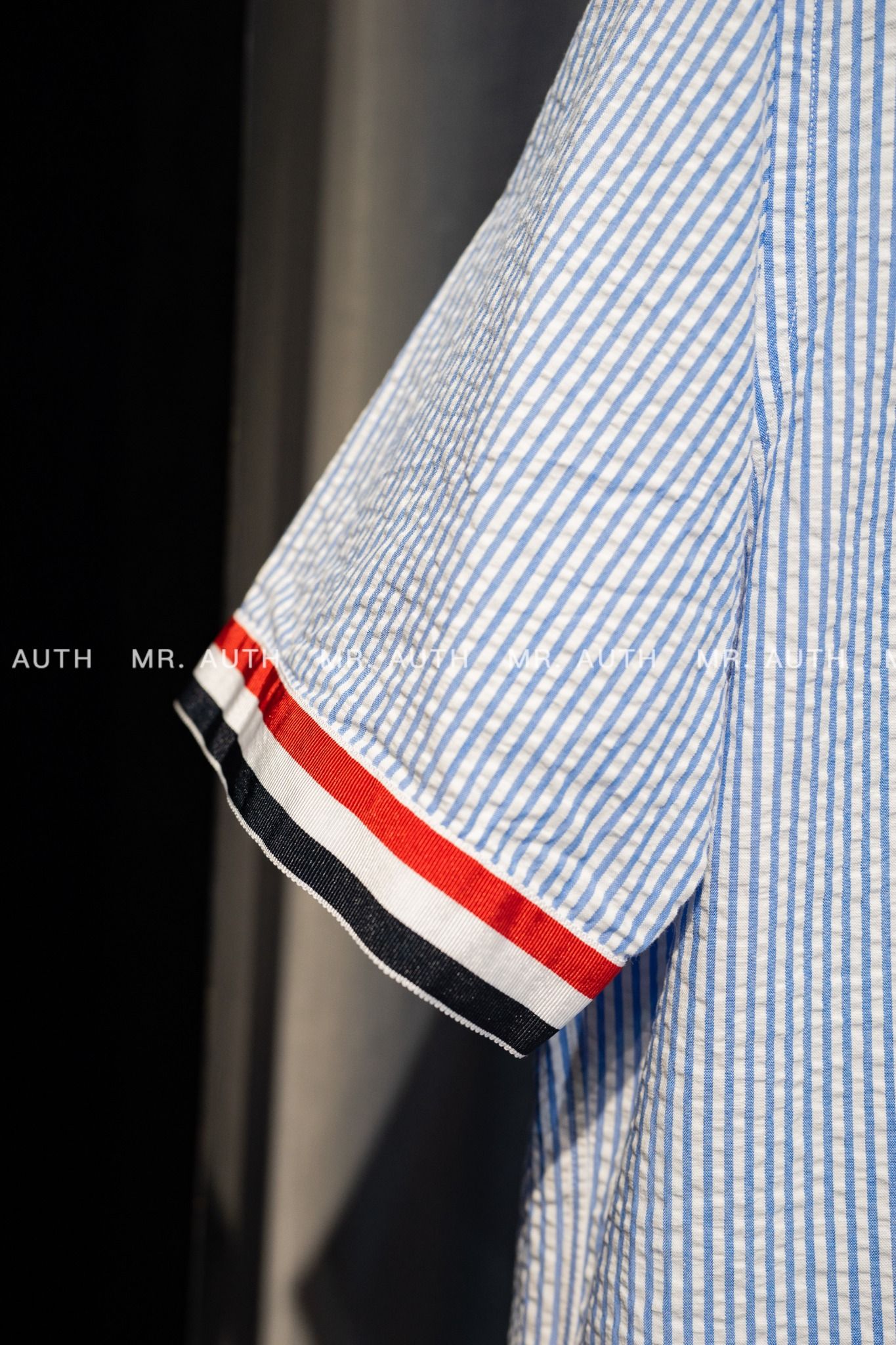 Thom Browne Light Blue Cotton Seersucker Grosgrain Cuff Straight Fit Short Sleeve Shirt.