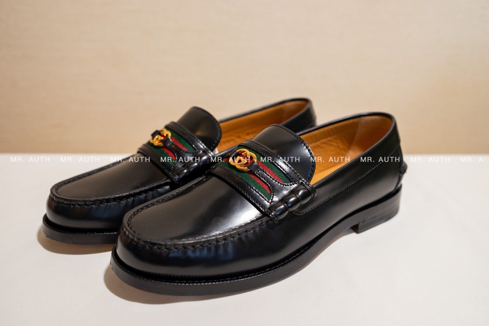 Gucci Kaveh Webbing-Trimmed Leather Loafers.