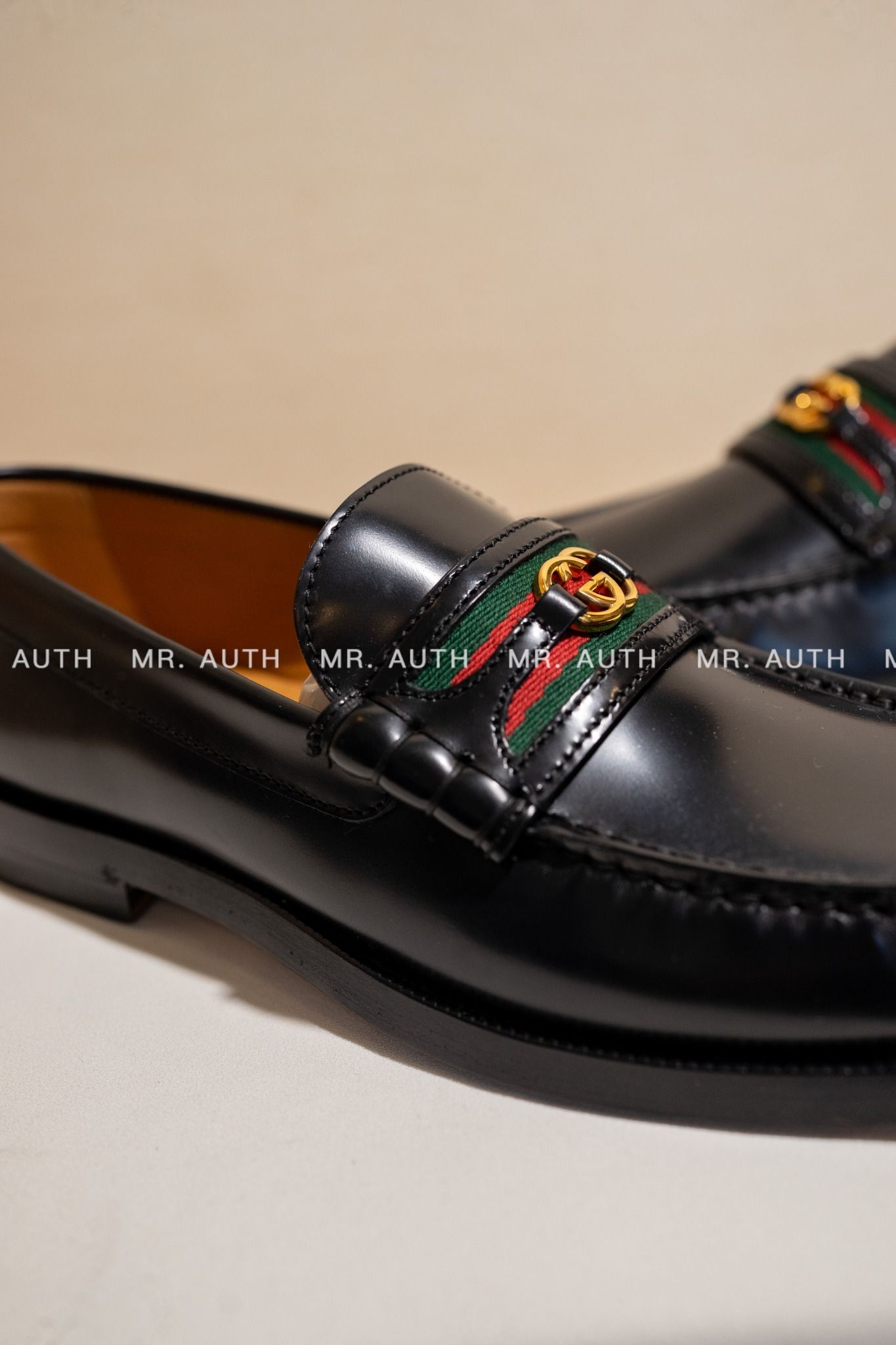 Gucci Kaveh Webbing-Trimmed Leather Loafers.