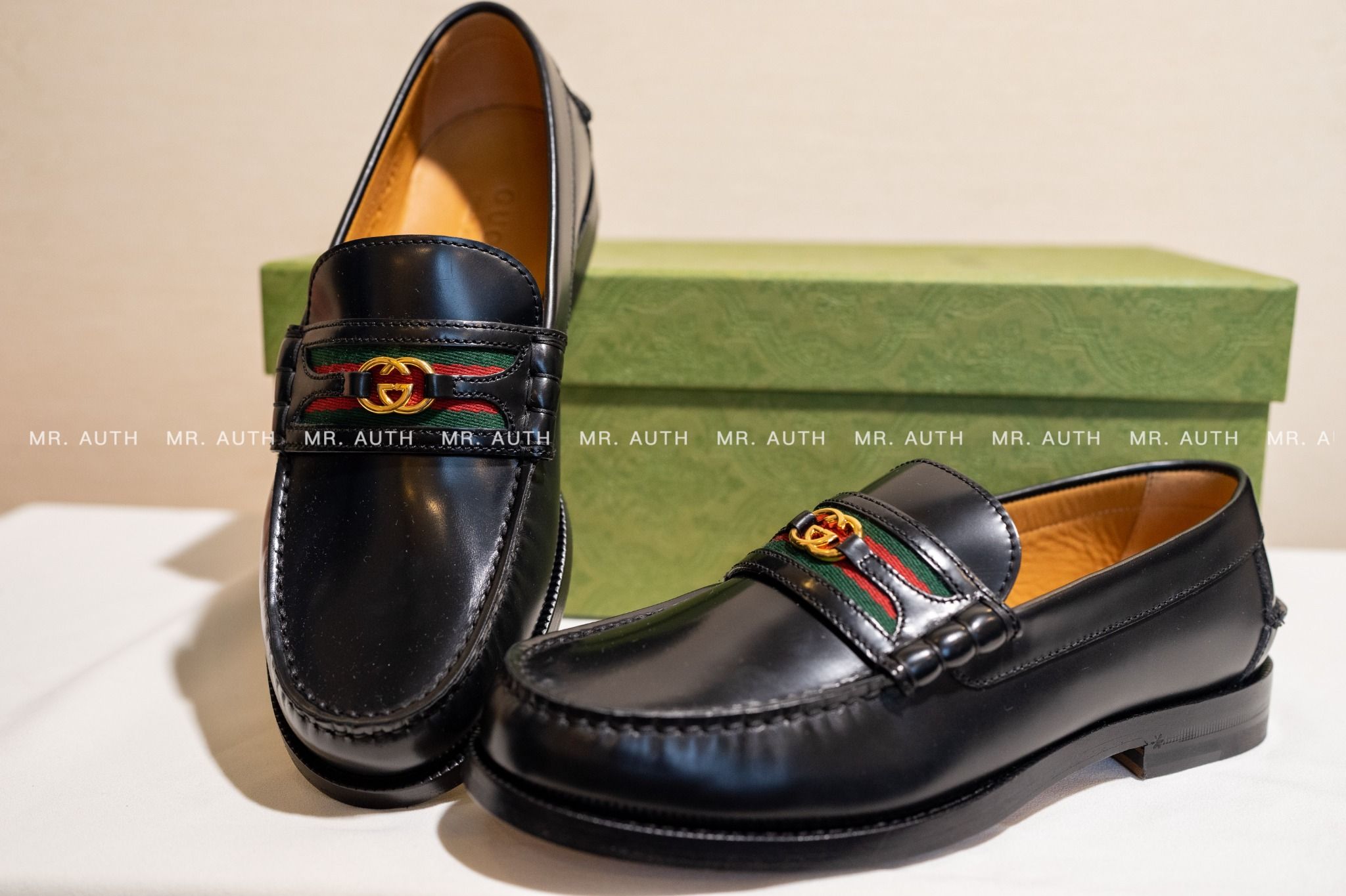 Gucci Kaveh Webbing-Trimmed Leather Loafers.