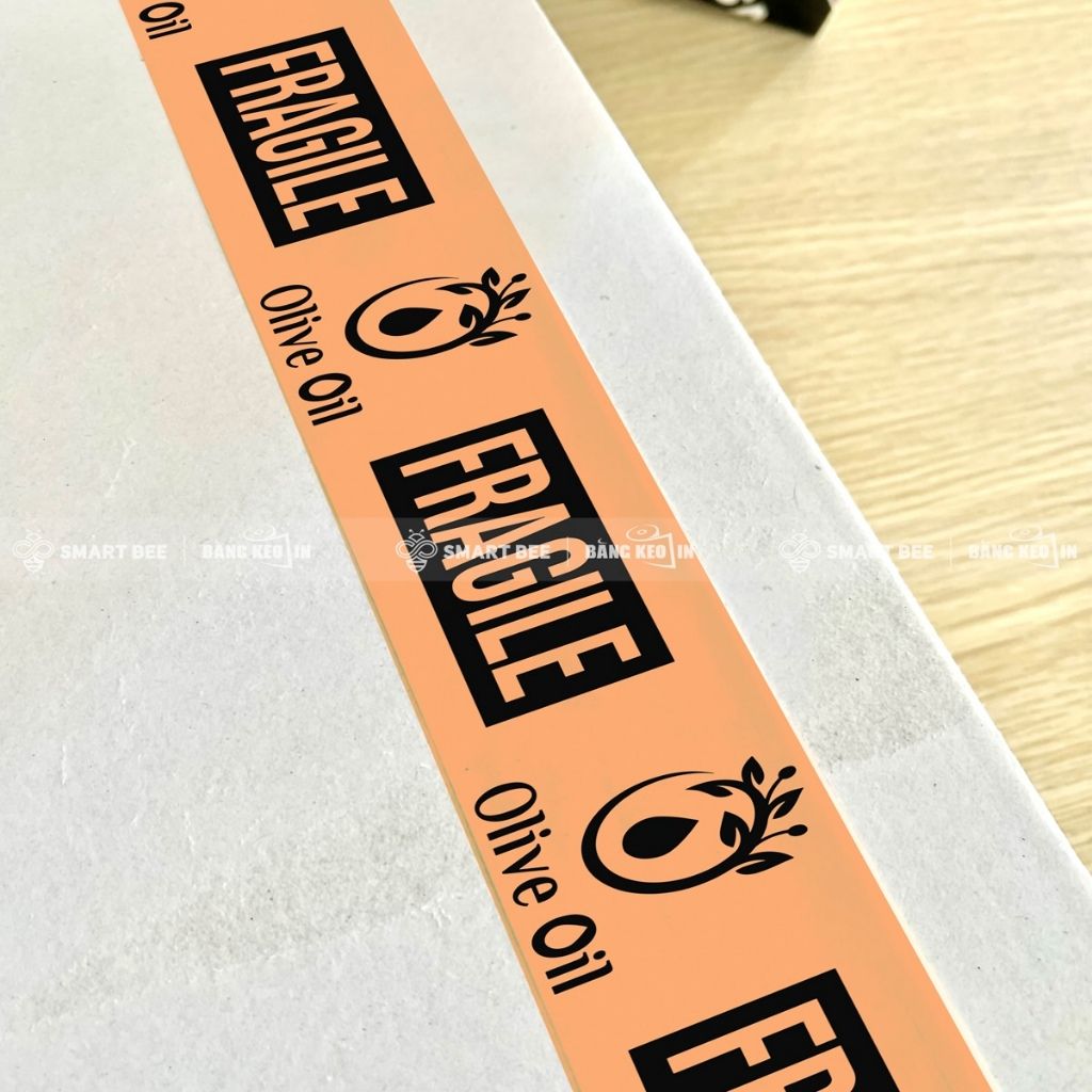 Băng keo màu CAM ĐÀO in chữ, in logo, in tên thương hiệu (in theo yêu cầu) BKMI