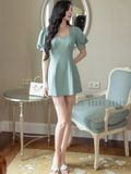 Đầm xanh mint tay phồng cúp ngực