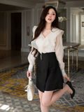 Chân váy đen vạt xéo