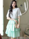 Chân váy xanh xếp ly tầng