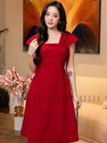 Đầm gấm đỏ tay con