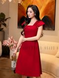 Đầm gấm đỏ tay con