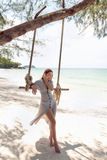 Đầm lụa gài nút tùng xòe xếp 2 li cúp ngực xám