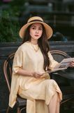 Set chân váy - áo tay liền vạt lệch vàng nhạt