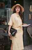 Set chân váy - áo tay liền vạt lệch vàng nhạt
