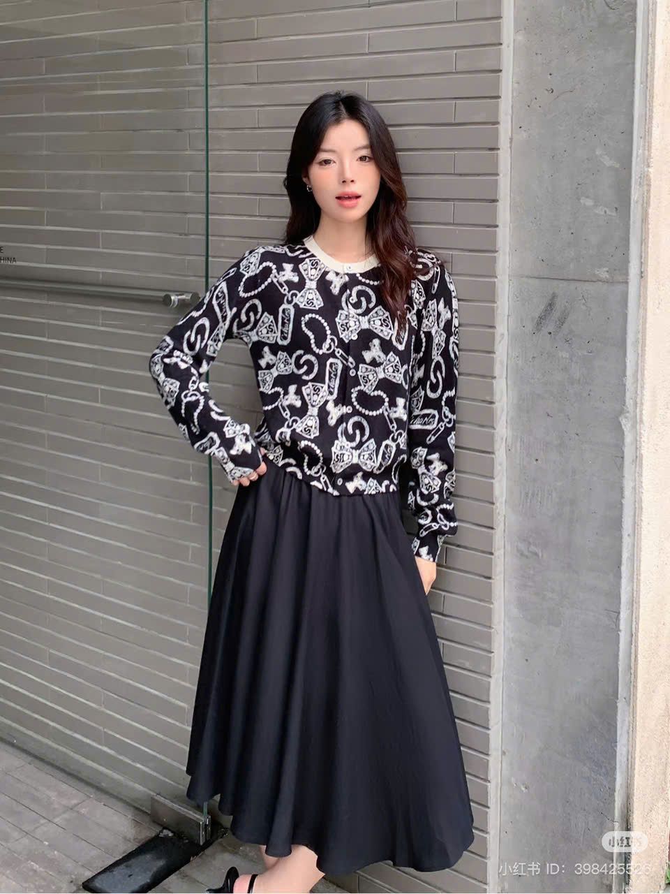 CDG đen họa tiết nơ tim