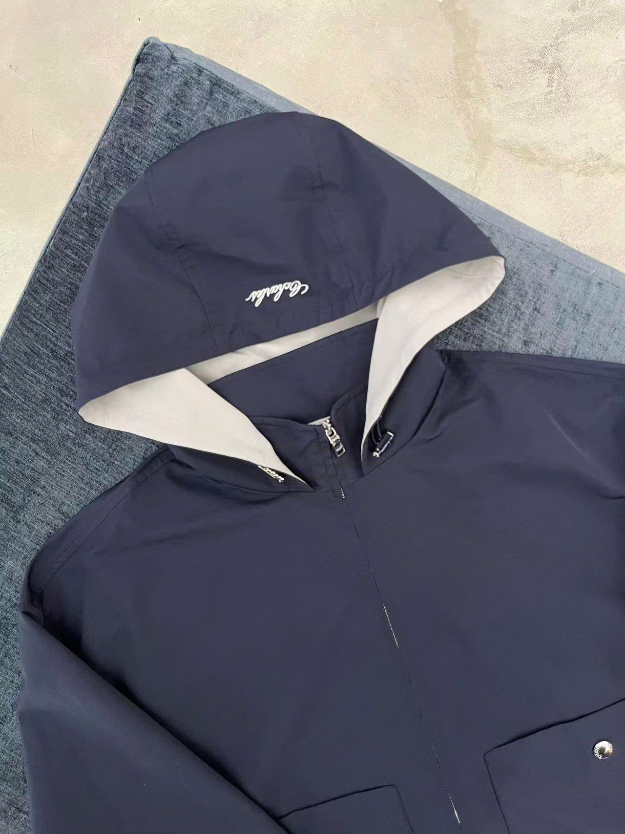 Bộ áo khoác gió và chân váy xếp ly xanh tím than set