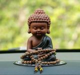 Tượng Phật Thiền Như Lai Chất liệu: Gốm đất sét tím Ứng dụng: Đồ trang trí xe hơi, bàn học Kích thước: 7x6x12 cm