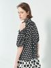 Áo màu đen chấm bi khoét vai nhún bèo