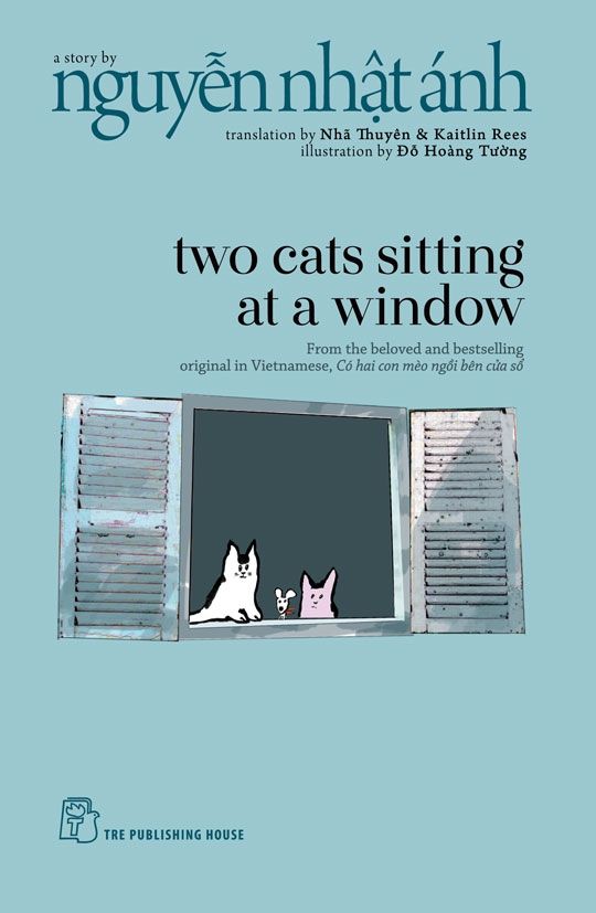 Two Cats Sitting at a Window