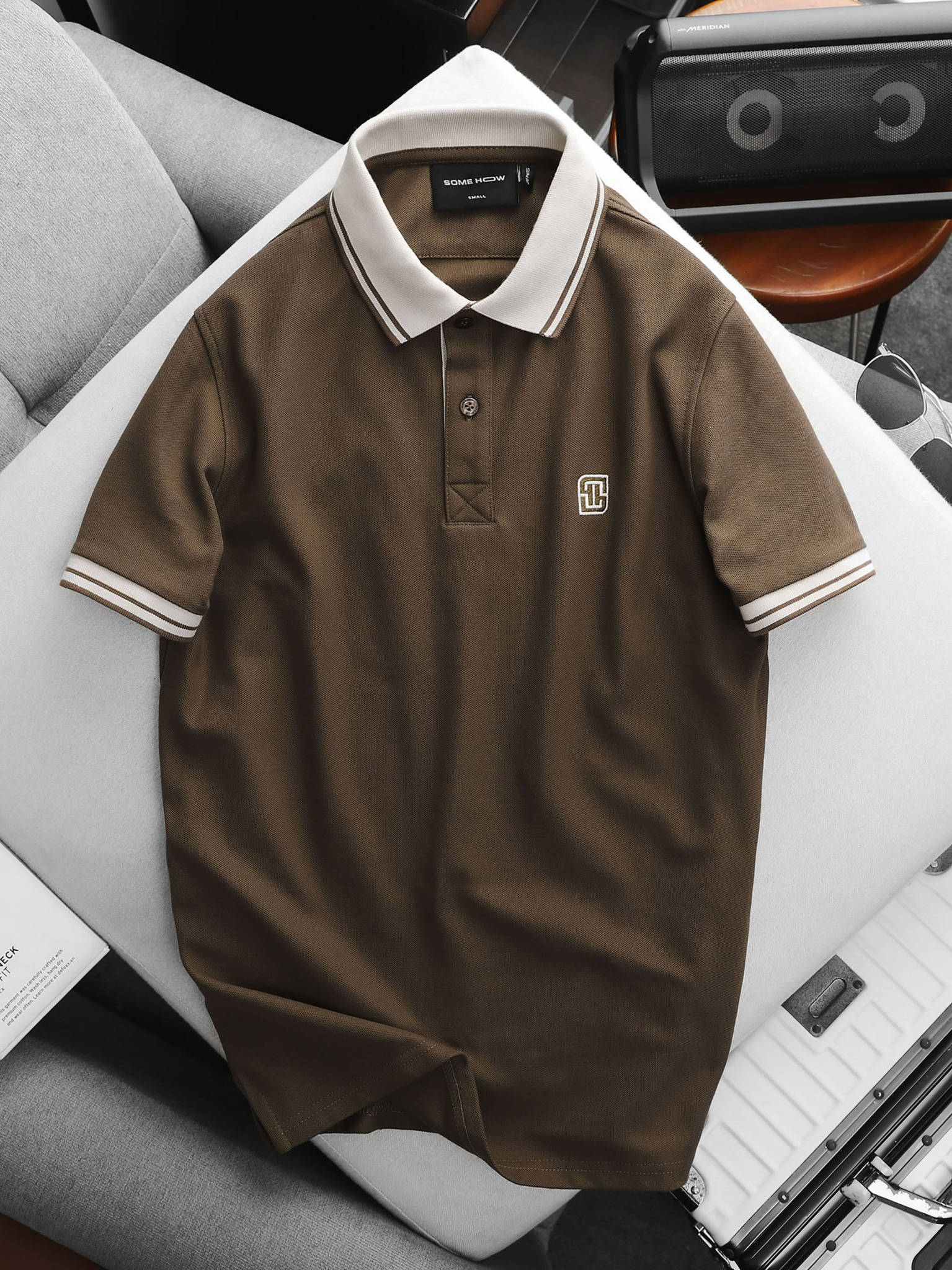 white and brown polo