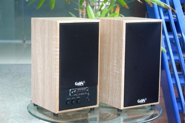 Loa Goldsound G25, công suất 100w, 2 Bass 4 inch, 2 Tress 3 inch, Bluetooth 5.0, cổng rca, khe usb, thiết kế 2 loa thùng gỗ cao 38 cm, rộng 21 cm, sâu 21 cm. Bảo hành 12 tháng