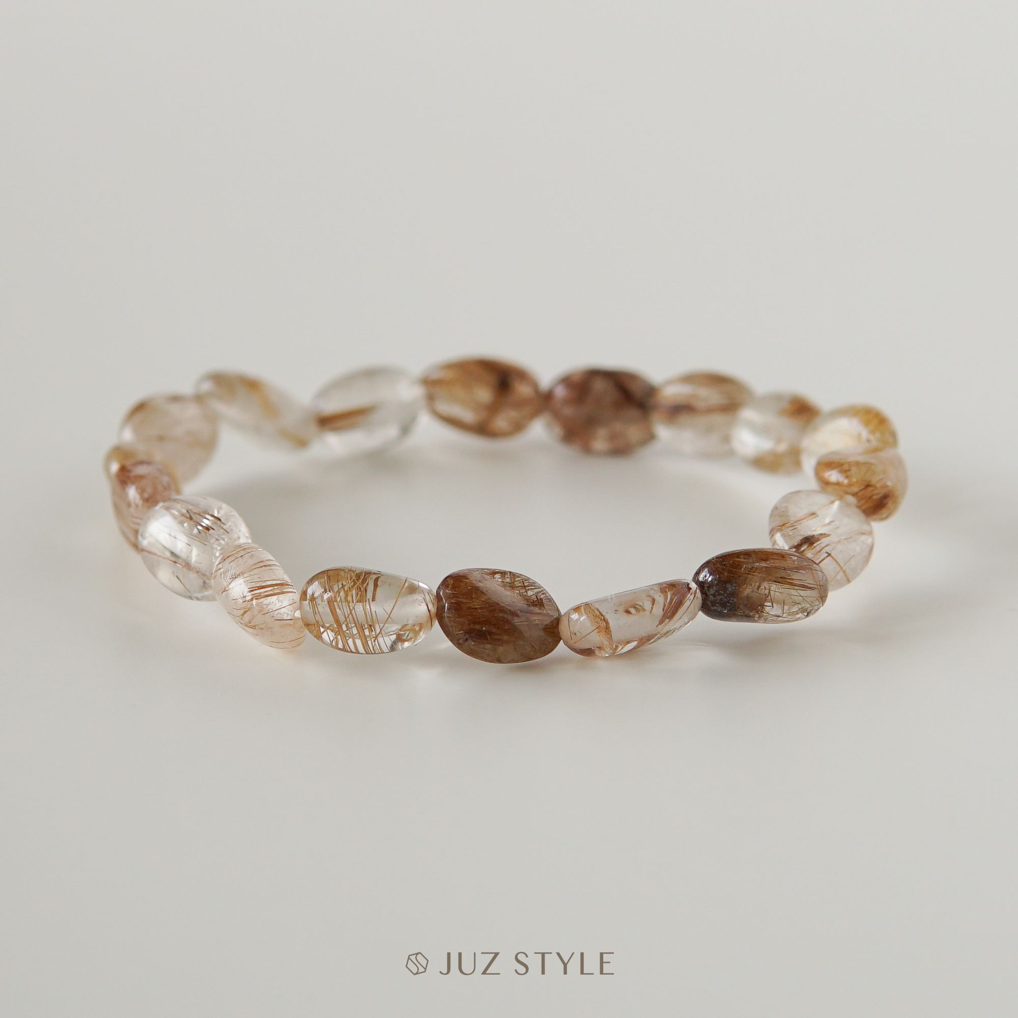 Vòng tay đá Thạch anh tóc đồng (Copper Rutilated quartz) Peble 9x7mm 