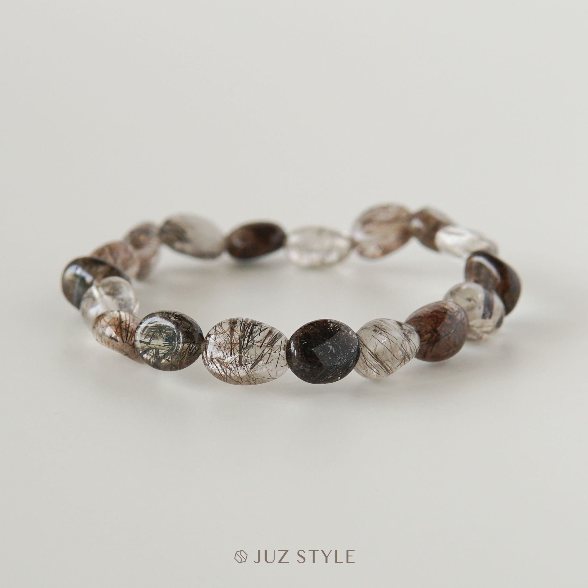  Vòng tay đá thạch anh tóc nâu (Brown Rutilated Quartz) Peble 9x7mm 