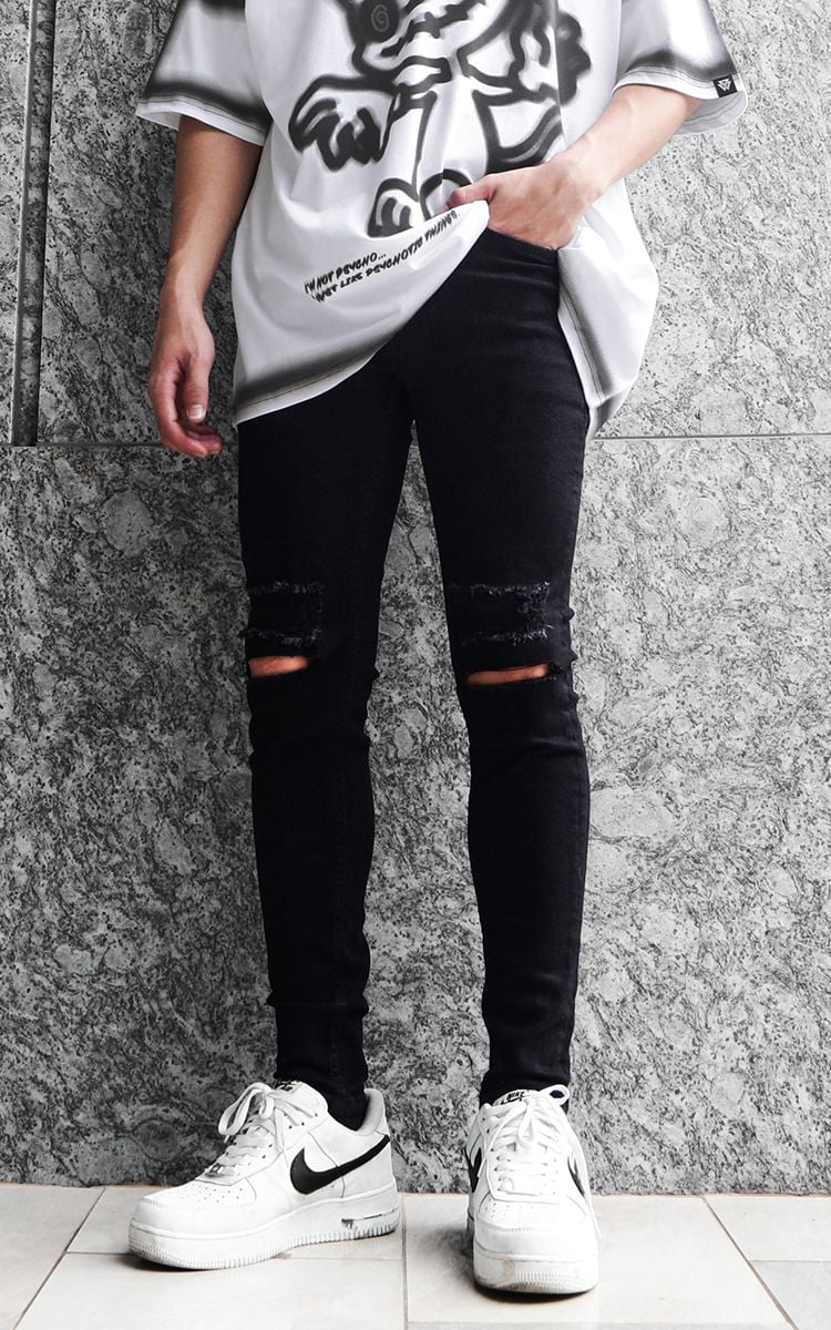 Ripped Distressed Skinny Jeans In Black